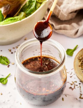 homemade salad dressing with balsamic vinegar poured over jar