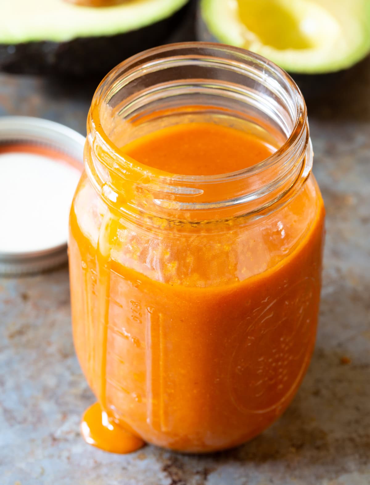 Homemade catalina dressing recipe with avocado in a mason jar.