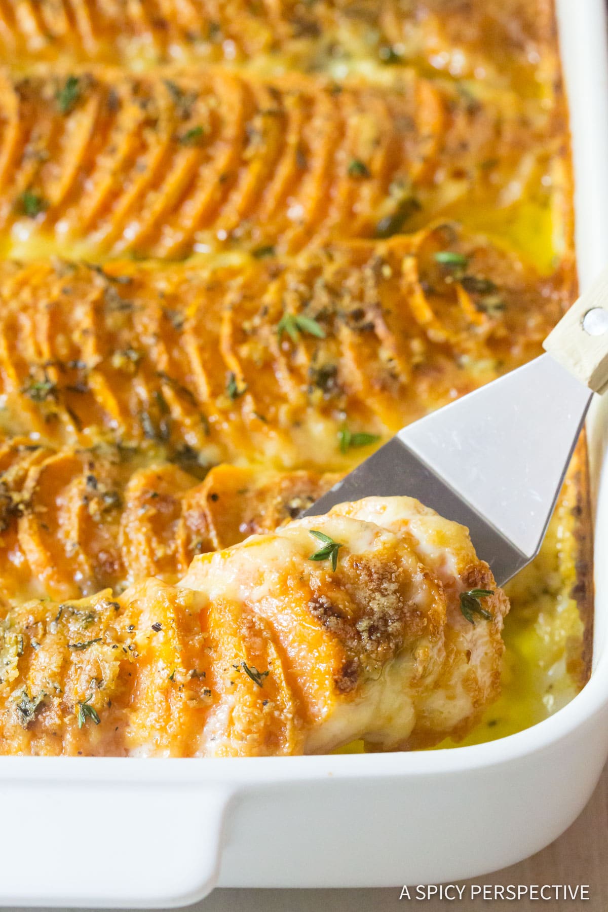 Best Garlic Butter Scalloped Sweet Potatoes Recipe - close up shot of buttery layers