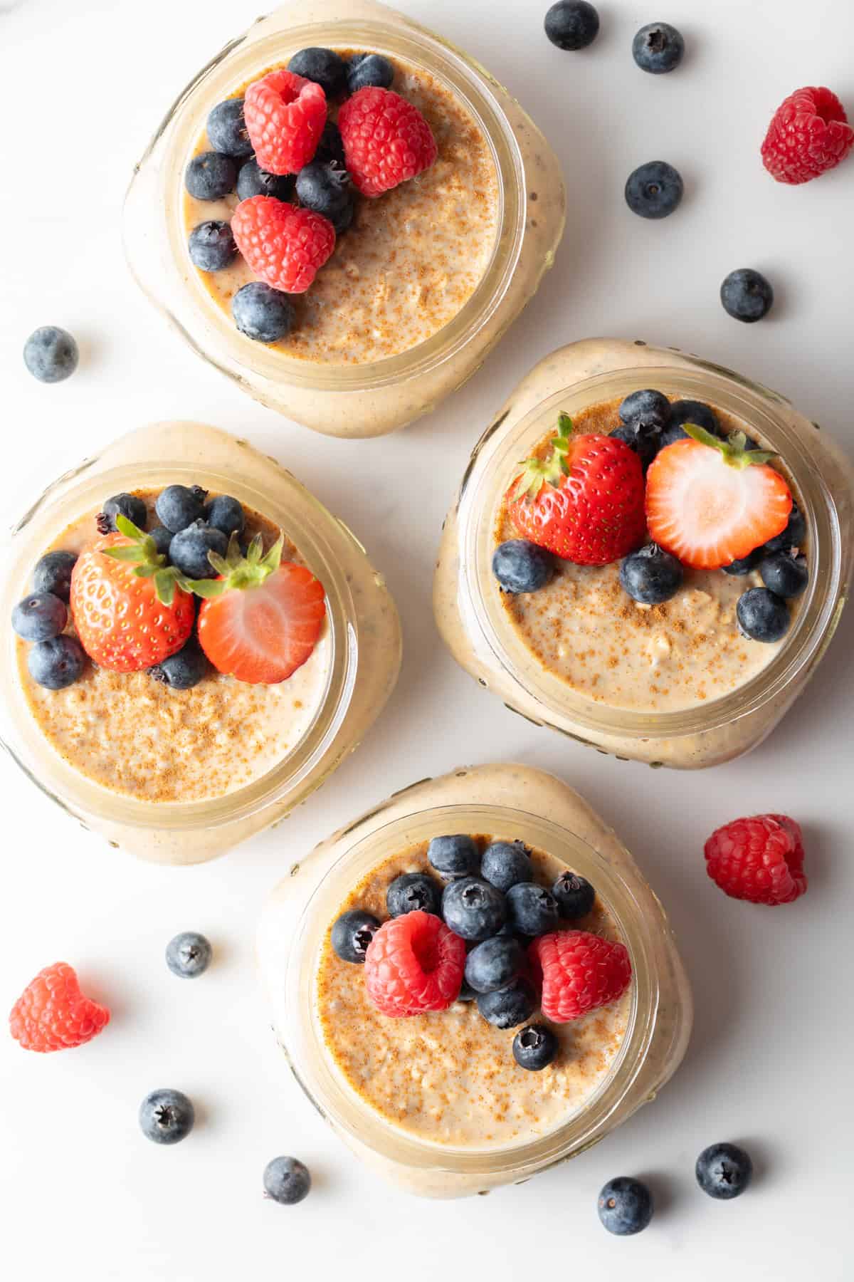 Overhead shot of overnight oats with protein powder and fresh berries
