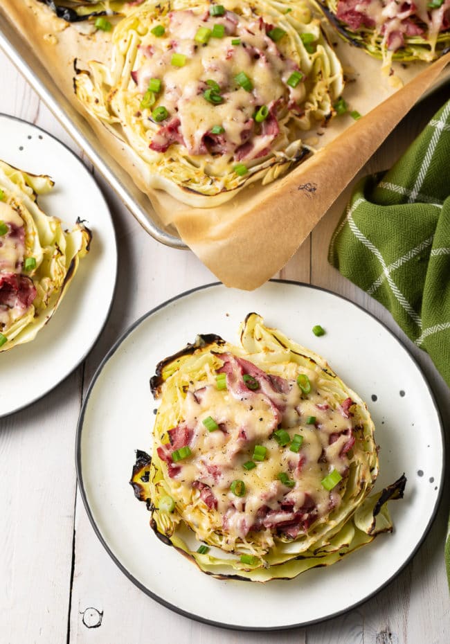 Irish Roasted Cabbage Low Carb Pizza Recipe: Roasted Cabbage Steaks piled high with Irish flavors! A 6-ingredient keto pizza concept that's easy to make and totally irresistible! #ASpicyPerspective #lowcarb #keto #irish #pizza #cabbage #cornedbeef #stpatricksday