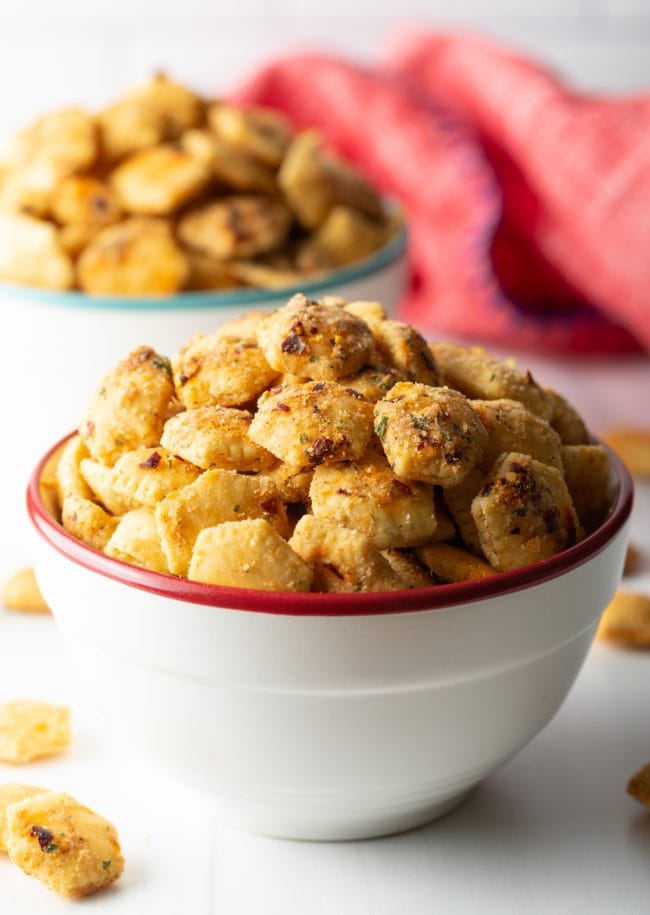 side up close view of bowl with spicy ranch oyster crackers overflowing